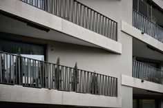 an apartment building with balconies and balcony railings