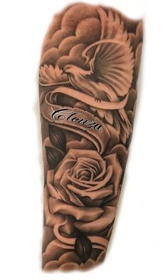 an arm tattoo with roses on it and a bird flying over the rose in the middle