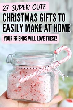 a hand holding a jar filled with candy canes and text that reads, 27 super cute christmas gifts to easily make at home your friends will love these