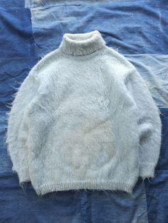 Listing: Vintage 1960s Mohair Turtleneck Sweater Ice Blue Made In Italy M Fuzzy Size on Tag: N/A Flaws: Large stain on the front side Measurements: Please see the photos in the listing. If you require additional measurements or information about this item, feel free to send a message. Cardigan Ideas, Fuzzy Mohair Sweater, Blue Turtleneck, La Face, Mohair Sweater, 70s Fashion, Vintage 1960s, Ice Blue, Turtleneck Sweater