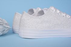 We have upgraded our production and shipping times.Now you can get your Wedding Converse faster than ever. 1-2 weeks production time guaranteed. Standard shipping transit times : USA 2-4 business days (Express at no extra cost) Made with love for your wedding day by Lovin Bridal - More Wedding shoes at our shop : http://lovincollection.etsy.com White Glitter Wedding Shoes For Bride, White Glitter Converse For Bride, Awesome Bridal Shoes For Destination Wedding, Reception Shoes It's the bride's p Silver Sneakers For Wedding With Round Toe, Silver Lace-up Sneakers For Wedding, Low-top Glitter Sneakers For Wedding, White Sparkling Wedding Shoes For Formal Occasions, Formal Sparkling White Wedding Shoes, Formal White Sparkling Wedding Shoes, Wedding Reception Shoes, Rhinestone Converse, Wedding Vans