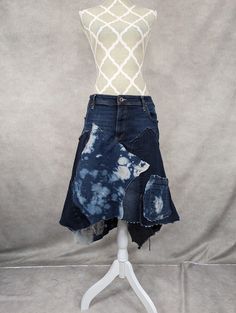 Upcycled plus size denim patchwork skirt with frayed seams and jagged hem. Waist measures 44", hips 48" and length varies from 22"-30". Affordable Blue Patchwork Denim Skirt, Cotton Patchwork Asymmetrical Skirt, Patchwork Denim Skirt In Recycled Denim Blue, Denim Blue Patchwork Skirt From Recycled Denim, Recycled Denim Patchwork Denim Skirt, Recycled Denim Patchwork Skirt, Recycled Denim Blue Skirt With Patchwork, Bohemian Cotton Denim Skirt With Frayed Hem, Medium Wash Cotton Skirt With Patchwork