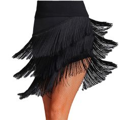 a woman's black skirt with fringes on the bottom and side, showing her legs