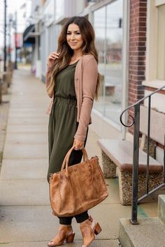 We love how this is such a great transitional piece going from season to season! The wrap style back is super fun and the cinched tie waist and jogger bottoms make this jumpsuit flattering for any body type. Add a bright pop of color, or a bold patterned cardigan or kimono, or even just a denim jacket with statement necklace! This is sure to be a staple in your closet. Versatile Jumpsuits And Rompers With Elastic Waistband, Casual Jumpsuits And Rompers With Tie Waist, Casual Jumpsuits And Rompers With Tie Waist For Fall, Summer Everyday Jumpsuits And Rompers, Chic Tie Waist Jumpsuits And Rompers For Day Out, Chic Fall Jumpsuits And Rompers For Loungewear, Casual Workwear Jumpsuit With Tie Waist, Trendy Jumpsuits And Rompers For Fall Day Out, Chic Tie Waist Jumpsuit For Day Out