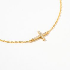 The Diamond Pave Cross Bracelet in 14K Solid Gold is the ultimate symbol of faith and fashion. This pave Christian bracelet is a stunning confirmation gift for women, featuring a real gold cross necklace design. Its intricate detailing and high-quality materials make it a timeless piece, adding elegance to any outfit. Perfect for daily wear or special occasions, this bracelet embodies both spiritual significance and luxurious style. 14k solid gold handcrafted pieces 100% ethical sourced jewelry Adjustable Yellow Gold Crucifix Jewelry, Elegant Adjustable Gold Cross Necklace, Elegant Cross Pendant Bracelet As A Gift, Elegant Cross Pendant For Confirmation, Elegant Confirmation Cross Pendant Jewelry, Elegant Gold Jewelry For Confirmation, Gold Cross Pendant Jewelry For Confirmation, Gold Cross Jewelry For Confirmation, Christian Bracelets