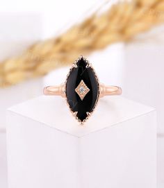 Ring Information Item: Black Onyx Engagement Ring Metal: 14k/18k solid gold, Platinum 950 Engagement Ring ▲Center Stone: Black Onyx Shape: Marquise cut Size: 16*8 mm ▲Side Stone: Natural Diamond Carat: approx 0.015 ct Diamond Color: G-H; Clarity: SI-VS ▲Ring Head: 18.5 mm Length; 9.3 mm Width; 5.3 mm Height ▲Band: 1.3 mm Thickness 1.5 mm Width(narrowest) ▲Gold Weight: about 3.5 g Service *Rush Order *Custom Order *Payment Plan *Engraving *Shipping Insurance *Lifetime Warranty Visit My Shop: http Onyx Gold Ring, Classic Onyx Diamond Ring, Black Onyx Vintage Ring, Black Marquise Cut Promise Ring, Black Onyx Marquise Engagement Ring, Classic Yellow Gold Onyx Rings, Vintage Onyx Ring, Milgrain Ring, Onyx Engagement Ring