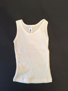 Wonderful white ribbed sleeveless tee from CLASSIC BABY NWOT Size 3 All questions appreciated and encouraged Cleaning out my Granddaughter's overstuffed closet. Most things have only been worn a handful of times. From smoke and pet free home. I will be listing many more GYMBOREE items as well as other brands. Any gently used items have all been freshly laundered. Will gladly combine items to save on shipping. PayPal preferred. White Ribbed Cotton Vest, Basic White Cotton Vest, Ribbed Tee, Downtown Outfits, Sleeveless Tee, Top Brands, Shoe Accessories, Tank Tops, Pet