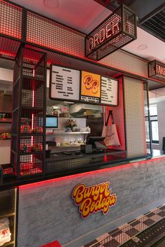 the inside of a fast food restaurant with neon lights