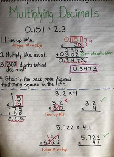 a white piece of paper with writing on it that says multiplying decimals