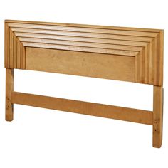 a wooden bed frame with slatted headboard and foot board on the side