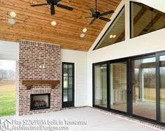 an open patio with a fireplace and ceiling fan