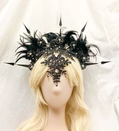 Our Gothic halo crown is a beautiful addition to your collection.  This lovely crown sits back on your head and is surprisingly comfortable.  The embroidered lace is covered with crystals and rhinestones.    Our collection of Crown Headpieces are designed to bring out the Goddess in each and every one of you.   Each piece is an original and hand made with pure love and passion for the craft.  Hours and sometimes days are spent designing and collecting the perfect embellishments for each and ever Structured Crown Black Headpiece For Wedding, Black Structured Crown Headpiece For Weddings, Black High Crown Headpiece For Wedding, Black Structured Crown Headpiece For Festival, Black Fantasy Headpiece With Structured Crown, Gothic Black Headpiece With Structured Crown, Black Tall Crown For Festival, Black Tall Crown Headpiece For Festival, Festival Tall Crown Black Headpieces