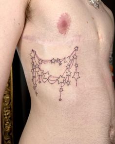 a man's chest with stars and crosses on it