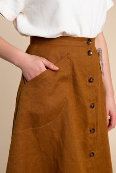 Part of our Rome Collection, the Fiore Skirt is a chic, high-waisted A-line skirt with just the right amount of flare and volume. A beginner-friendly pattern with multiple variations, this elevated basic has tons of outfit potential. Available in above or below the knee lengths, the Fiore Skirt has three views. View A is a simple flared skirt with an invisible zipper at the back. View B is an asymmetrical wrap skirt with a single hip pocket. View C buttons up the front with curved patch pockets. A Line Skirt Pattern, Closet Core Patterns, Skirt Sewing, Basic Skirt, Garment Pattern, Handmade Wardrobe, Skirt Patterns Sewing, Sewing Skirts, Skirt Pattern