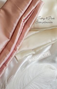 pink sheets and pillows on top of each other