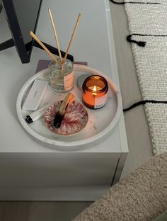 a tray that has candles and other items on it