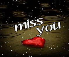 a red heart floating in water with the words miss you