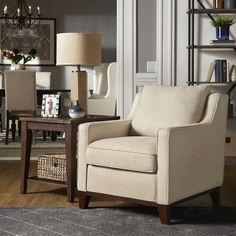 a living room scene with focus on the chair and coffee table in the foreground