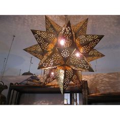 a star shaped chandelier hanging from the ceiling