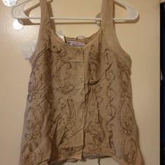 Embroidered Top Embroidered Fitted Tank Top For Spring, Fitted Embroidered Tank Top For Spring, Fitted Embellished Embroidered Top For Summer, Spring Festival Embroidered Tank Top, Fitted Embellished Beige Tops, Embellished Fitted Casual Tank Top, Casual Embellished Fitted Tank Top, Beige Embellished Sleeveless Top, Sleeveless Embellished Beige Top