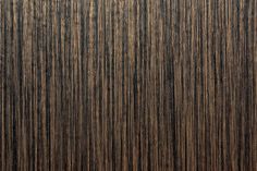 a close up view of the wood grains on this wallpapered surface, which looks like it has been painted in dark brown