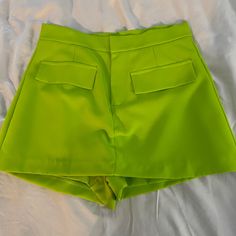 Never Worn. Was Too Small For Me. Adorable Bright Green Neon Skort. You Can See The Shorts In The Back - Skirt In The Front. Dress Up. Business Casual. Fitted Party Shorts With Pockets, High-waisted Party Shorts With Pockets, Casual Green Skort For Party, Green High Waist Skort For Party, Summer Shorts With Pockets For Night Out, High Waist Green Skort For Party, Casual Green Skort With Short Inseam, Casual Green Short Skort, Green Shorts For Night Out