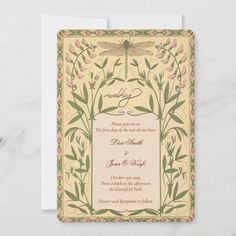 a wedding card with a dragonfly on the front, and flowers in the back