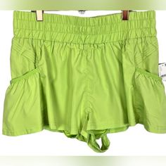 Free Movement Chartreuse Shorts. So Flirty And Fun To Spice Up Your Workout Attire. Flowing Style With A High Rise Smocked Waistband And Side Pockets. Pull On Style Elastic Waistband With Side Pleated Accents With Attached Underline. Perfect For Training, Running Or Any Workout. Nwt. Size L Waist. 16" Across Laying Flat Rise. 12" Inseam. 2" 100% Nylon Machine Wash B14 Green Stretch Shorts With Side Pockets, Spring Green Bottoms With Gathered Waist, Stretch Shorts With Pockets For Vacation, Compressive Functional Green Athletic Shorts, Green Nylon Athletic Shorts, Playful Green Sports Shorts, Green Athletic Shorts With 4-way Stretch And Elastic Waistband, White Biker Shorts, Orange Free People Shorts