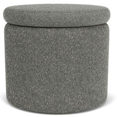 a grey ottoman with a round cushion on it's top and bottom, sitting in front of a white background