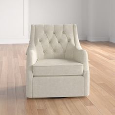 a white chair sitting on top of a hard wood floor