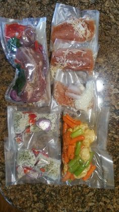 four packaged food items sitting on top of a counter