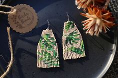 Handmade Green Bohemian Tassel Earrings, Unique Handwoven Green Earrings, Handmade Nature-inspired Dangle Beaded Earrings, Casual Handmade Beaded Dangle Earrings, Green Bohemian Earrings For Everyday, Green Bohemian Earrings For Everyday Wear, Handmade Green Tassel Earrings For Beach, Handmade Green Tassel Earrings For Summer, Green Macrame Dangle Earrings