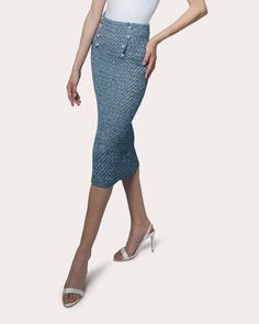 An elegantly elongated midi that follows the contours of your figure, the Scarlet skirt is hand-crocheted with an open stitch knit to create a peek-a-boo effect. The high-rise pencil silhouette features a sailor-inspired waistband detailed with scalloped trim and Italian pearl buttons. Pair with the matching Margot Crocheted Crop Polo in Blue Denim for monochromatic appeal. Snap closure Pearl buttons High-rise waistline Scalloped details Semi-sheer (unlined) Hand-crocheted 100% Italian cotton Ha Luxury Chic Fitted Denim Skirt, Luxury Casual Denim Blue Skirt, Crochet Denim Mini Skirt, Luxury Cotton Denim Skirt In Denim Blue, Luxury Cotton Denim Blue Skirt, Pencil Silhouette, Animal Fur, High Hips, Scalloped Trim