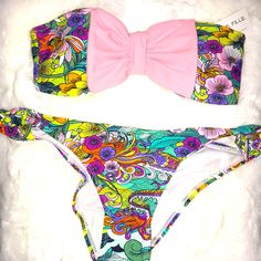 Size L/Xl Multicolor Swimsuit With Beautiful Design A Pastel Pink Bow In The Front Of The Top The Top Does Have Padding They Are Removable New With Tags The Swimsuit Does Come With Removable Straps Playful Pink Swimwear For Beach Party, Playful Pink Swimwear For Sunbathing, Playful Pink Printed Swimwear, Multicolor Bandeau Swimwear For Spring, Spring Multicolor Bandeau Swimwear, Pink Party Swimwear For Spring, Fun Pink Swimwear For Beach, Pink Fun Swimwear For Beach Party, Fitted Pink Swimwear For Spring