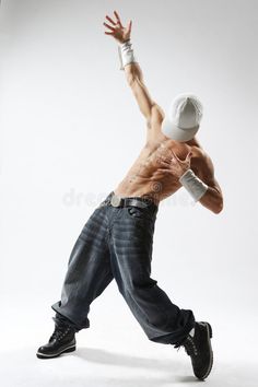 a man in jeans and a white hat is dancing