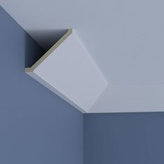 the corner of an empty room with blue walls