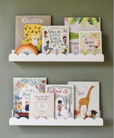 two white bookshelves with children's books on them