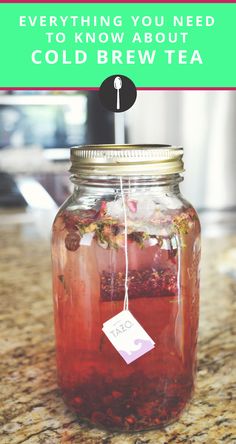 a jar filled with liquid sitting on top of a counter