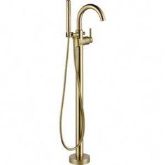 an image of a gold shower faucet with hand shower head and handset