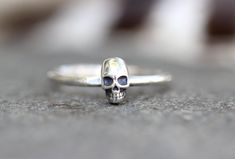 This listing is for one feminine and dainty sterling silver skull stacking ring. It features one small sterling silver skull fired onto 14 gauge sterling silver wire. Its both elegant and edgy and perfect for witchy women, men, and people who love skulls and halloween. It looks great solo or stacked with other rings and bands.- Choose your size at check-out!- Skull measures 7mm by 5mm.- Ring band is 1 mm thick.Want to stack it with some awesome textured silver stacking bands? Find them here:http Witch Ring, Witchy Women, Skull Fire, Witch Rings, Jewelry Skull, Rings And Bands, Raw Crystal Ring, Silver Skull Ring, Skull Rings