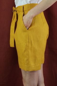 "Women linen shorts with 2 pockets in mustard color, perfect for casual wear and suitable for any occasion in any season Details: - 100% natural linen produced in Europe ; - medium weight (180 gram per square meter); - color: mustard, can be any from our colors catalogue (color samples at the photo); Made to order, approximately a few days, If you have any questions please message me and I will be glad to answer. Size guide : Size XS Bust: fits bust around 33\"-34\"/ 84-88 cm Waist: fits waist a Knee-length Shorts With Side Pockets For Summer, Fitted Linen Summer Shorts, Spring Linen Shorts With Side Pockets, Linen Shorts With Side Pockets For Spring, Yellow Bermuda Shorts For Summer, Yellow Cotton Shorts With Pockets, Summer Linen Shorts With Side Pockets, Solid Linen Shorts With Built-in Shorts, Solid Linen Shorts