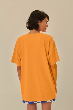 Embrace the vibrant spirit of Brazil with the Orange Farm Rio To Table Organic Cotton T-Shirt. This sun-kissed orange tee features a round neckline and a relaxed fit, perfect for casual days out. Adorned with a playful, tropical illustration that captures the essence of Brazilian flora and fauna, it's a piece that brings joy and color to any outfit. Made with organic cotton, it's not only stylish but also gentle on the planet. Composition 100% COTTONCare Instructions MACHINE WASH, GENTLE CYCLE, DO NOT BLEACH, DO NOT TUMBLE DRY, LINE DRYING, IRON AT MEDIUM HEAT, DRY CLEAN WITH ANY SOLVENT EXCEPT TRICHLOROETHYLENESize and Fit Inches XXS XS S M L XL Bust 40 2/4 42 2/4 44 2/4 46 2/4 49 2/4 52 2/4 Waist 40 3/4 42 3/4 45 46 3/4 49 3/4 52 3/4 Length 28 28 2/4 29 1/4 29 2/4 30 3/4 31 2/4 Hip 43 3/ Table Organic, Orange Farm, Tropical Illustration, Orange Tees, Brings Joy, Farm Rio, Flora And Fauna, Days Out, Sun Kissed