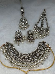 Earring Length: 3.5 in X Width: 1 in Necklace Length: 2.5in Tikka Length: 6.5 in Passa Length: 6 in x Width: 3 in Metal: Alloy With Good Quality Gold Plated Color: White Stone: Kundan   Package Content: 1 Pair Of Earrings x 1 Necklace x 1 Tikka x 1 Passa Back Finding: Post With Friction Back x Earring Style: Dangle Care Instruction : Avoid Heat & Chemicals Like Perfume, Deo, Alcohol, Etc. | Clean With Dry Cotton Cloth | Pack In An Air Tight Container After Use. Desi, desi bride, Sikh bride, brid Dulhan Bridal, Pastel Trends, Sikh Bride, Kundan Choker Set, Statement Earrings Wedding, Bollywood Bridal, Desi Bride, Kundan Choker, Bridal Necklace Set