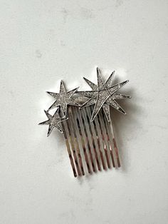 Petite silver celestial star hair comb. Perfect for tucking into any bridal hair style. This is a sample piece. Only one available. Dimensions: Hair comb is 2.5" tall and 2.5" inches wide. Each order is thoughtfully gift wrapped and shipped in a gold embossed Luna + Stone branded keepsake box. These boxes are perfect for gifting and storing your accessories long after your big day. SHIPPING to the USA * Free standard shipping is included (2-4 weeks for delivery via Canada Post Small Packet Air). Celestial Headpiece, Star Hairpiece, Star Wedding Hair Piece, Constellation Hair Accessories, Bridal Hair Accessories Stars, Celestial Hair Comb, Star Hair, Crystal Stars, Star Wedding