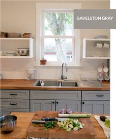 an image of a kitchen setting with cutting board on the counter and window in the background