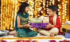 two people sitting on the ground with gifts