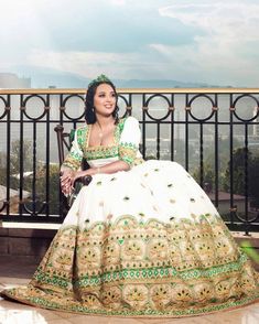 Embark on your journey of love with our "Enchanting Elegance" Habesha Wedding Dress, a masterpiece that captures the essence of romance and cultural richness. This extraordinary habesha kemis is adorned with intricate beadwork and features mesmerizing green and multicolor designs, creating a stunning and unique ensemble for your special day. Handwoven with meticulous precision and adorned with delicate embroidery, this wedding dress is crafted from Menen fabric, a lightweight cotton renowned for