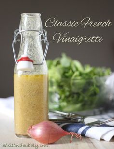 a bottle filled with dressing sitting on top of a table