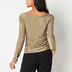 This Worthington women's asymmetrical blouse is a glamorous golden top to make a statement on your next night out. It's made from a stretchy metallic fabric with an asymmetrical neck and long sleeces. Style it with tailored pants or jeans for a chic evening ensemble.Fit: Regular FitNeckline: Asymmetrical NeckSleeve Length: Long SleeveApparel Length: 22 InchesFiber Content: 75% Nylon, 22% Metallic, 3% SpandexFabric Description: RibCare: Tumble Dry, Machine WashCountry of Origin: Imported Gold Blouse For Night Out, Versatile Long Sleeve Party Tops, Versatile Long Sleeve Tops For Evening, Versatile Evening Tops For Fall, Elegant Asymmetrical Knit Top, Elegant Asymmetrical Tops For Fall, Fall Tops With Asymmetrical Neckline, Chic Gold Stretch Top, Elegant Blouse With Asymmetrical Neckline For Fall