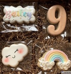 decorated cookies in the shape of clouds and rainbows